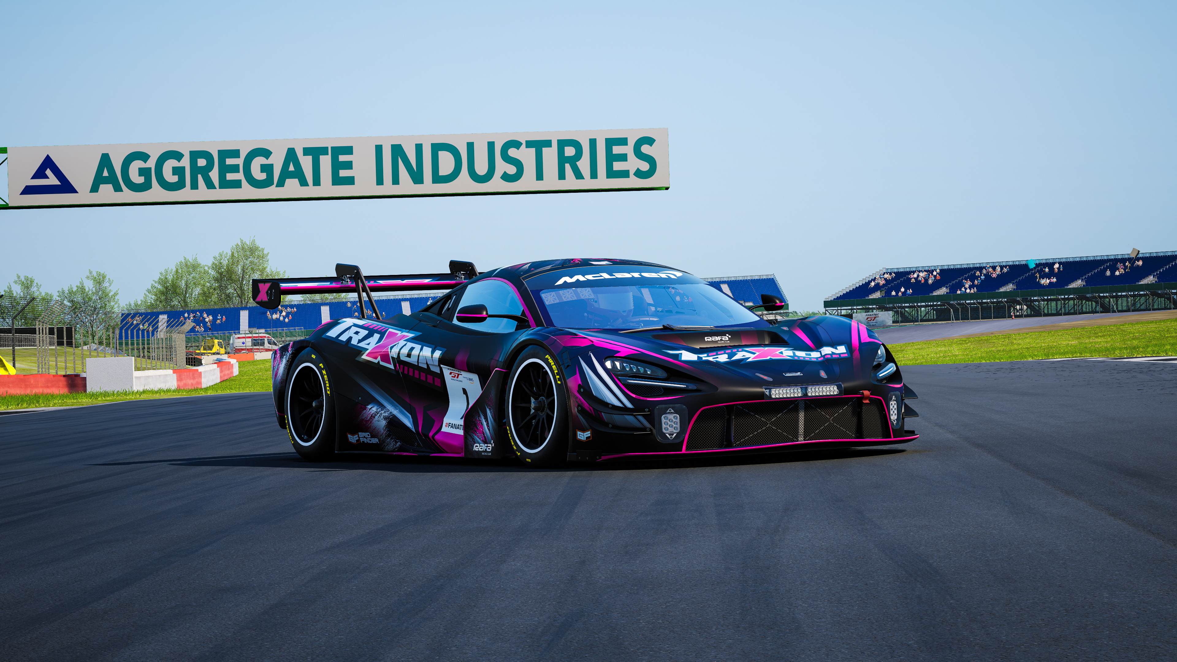 Traxion race car on track beneath an Aggregate Industries sign