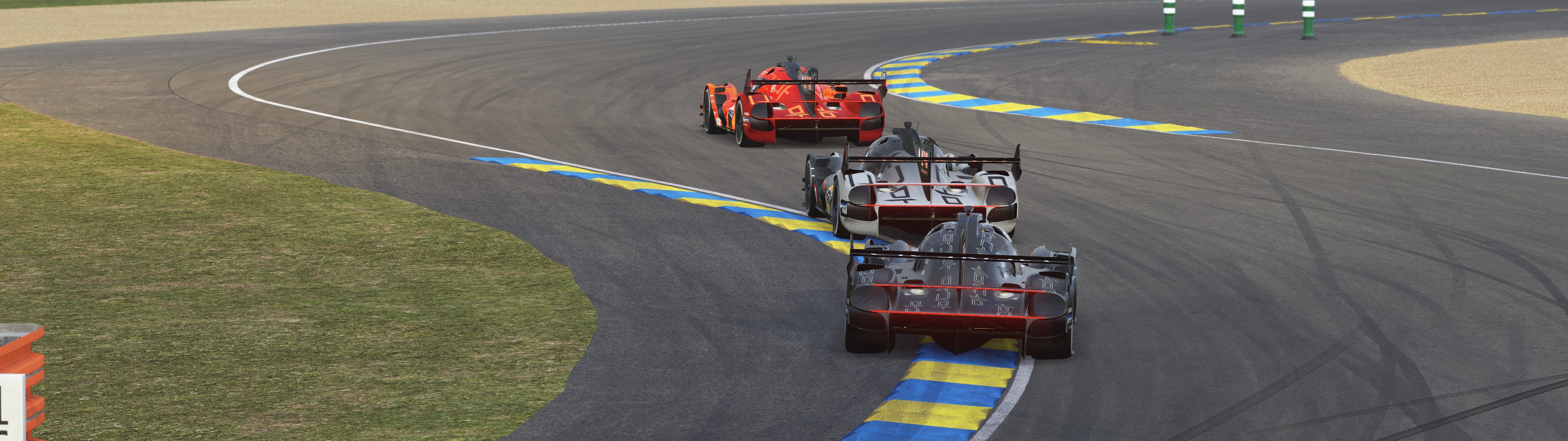 Rear view of three Genesis GMR-001 Hypercars racing together in Le Mans Ultimate