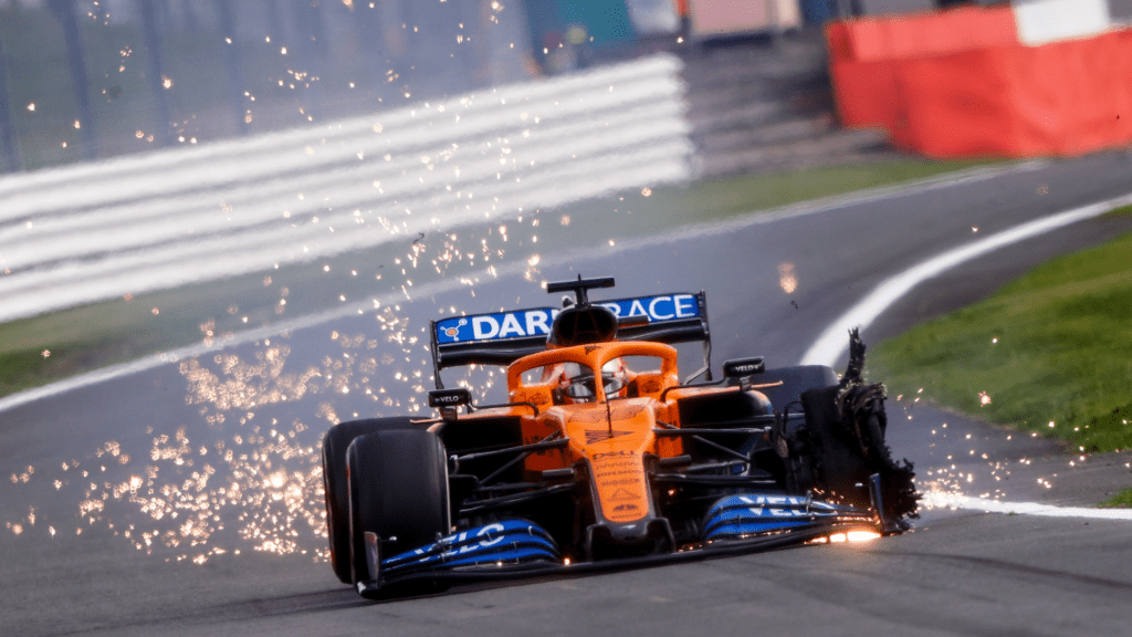Carlos Sainz, McLaren MCL35, heads into the pits with a front puncture - ID: 1018144475m, Photographer: Andy Hone, Motorsport Images
