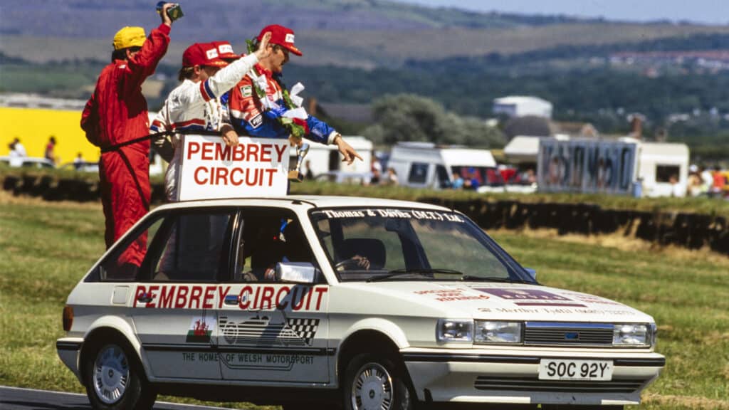 Pembrey Circuit, BTCC 1993 - Ian Khan, Independents winner, Joachim Winkelhock, 1st position, Steve Soper, 3rd position, and Will Hoy, 2nd position, are driven on a lap of honour. Motorsport Images