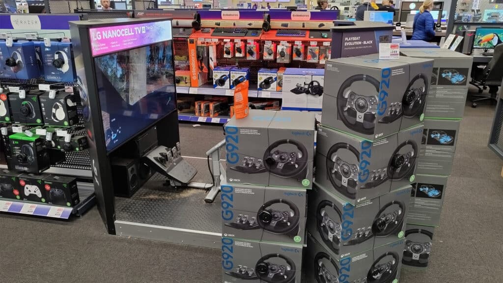 A pile of Logitech G290 wheels in a UK retail store
