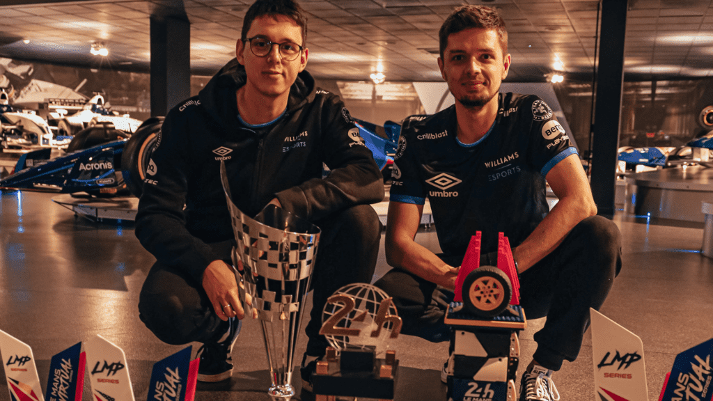 Niko and Kuba surrounded by their Williams Esports trophies