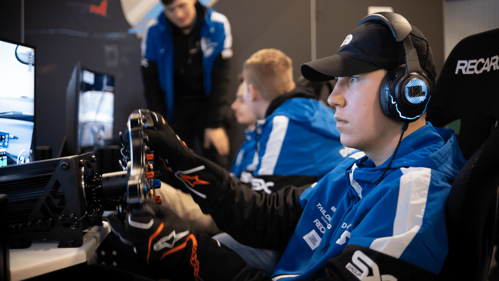 Tim Jarschel driving a simulator for Dörr Esports